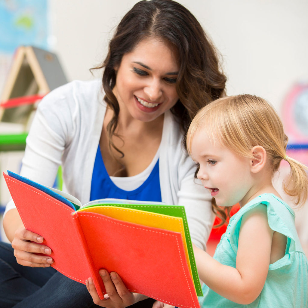 Lifestyle Square Teacher Reading Book With Child Lifestyle Square Teacher Reading Book With Child